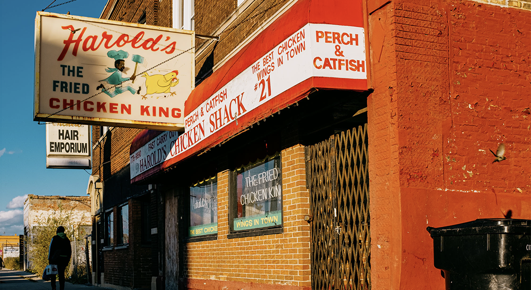 Harold's chicken shop with bright red awning and red brick